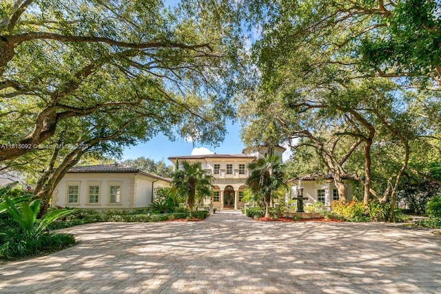 9500 SW 62nd Ct, Pinecrest, FL 33156 - mediterranean / spanish-style home with decorative driveway and stucco siding