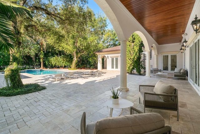 9500 SW 62nd Ct, Pinecrest, FL 33156 - view of patio featuring french doors and an outdoor pool