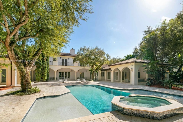 9500 SW 62nd Ct, Pinecrest, FL 33156 - view of swimming pool featuring a patio and a pool with connected hot tub