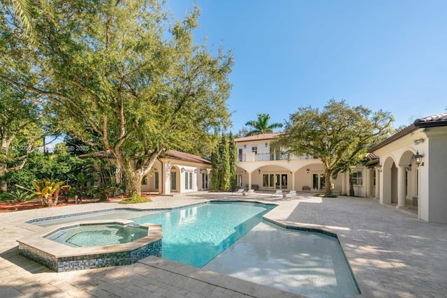 9500 SW 62nd Ct, Pinecrest, FL 33156 - view of swimming pool featuring a patio area and a pool with connected hot tub