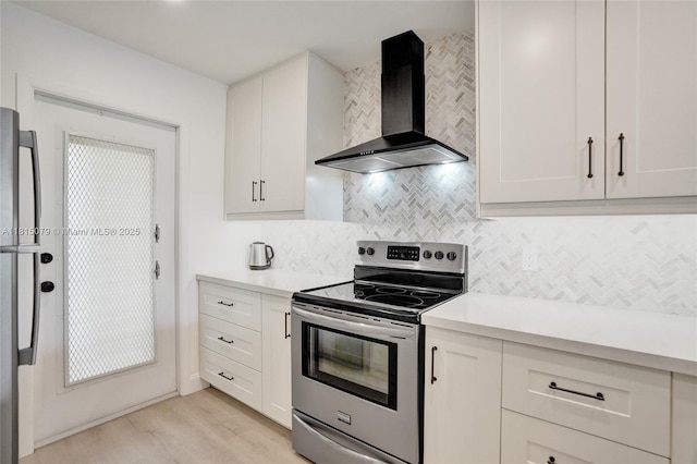 3150 N Course Ln Unit 405, Pompano Beach, FL 33069 - kitchen with stainless steel electric stove, wall chimney range hood, backsplash, and light countertops
