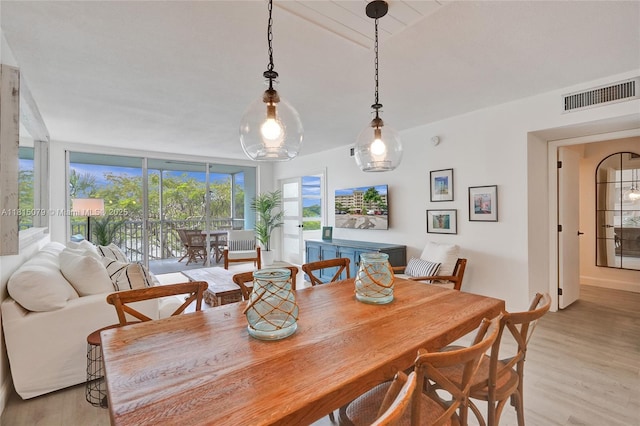 3150 N Course Ln Unit 405, Pompano Beach, FL 33069 - dining room with light wood-style flooring and baseboards