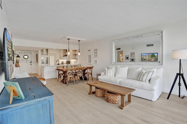 3150 N Course Ln Unit 405, Pompano Beach, FL 33069 - living area with light wood-type flooring and baseboards