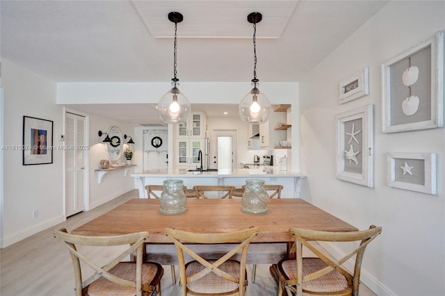 3150 N Course Ln Unit 405, Pompano Beach, FL 33069 - dining space with baseboards and light wood finished floors