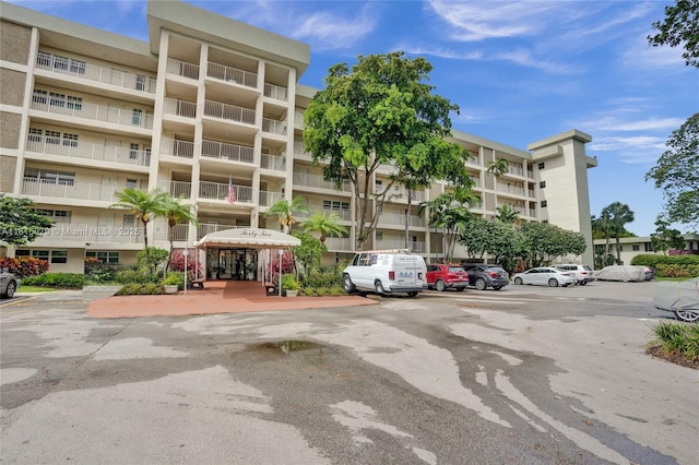 3150 N Course Ln Unit 405, Pompano Beach, FL 33069 - view of apartment building / complex featuring uncovered parking