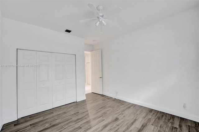 1463 SW 156th Way, Pembroke Pines, FL 33027 - unfurnished bedroom with wood finished floors, a closet, baseboards, and a ceiling fan