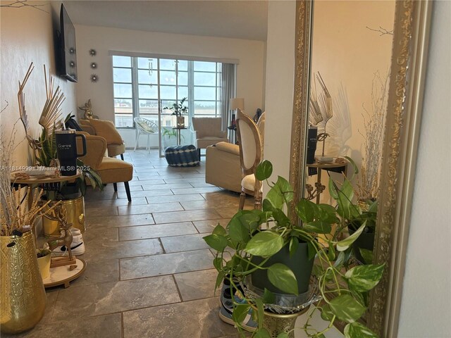 9041 Sunrise Lakes Blvd Unit 311, Sunrise, FL 33322 - living room featuring stone tile floors