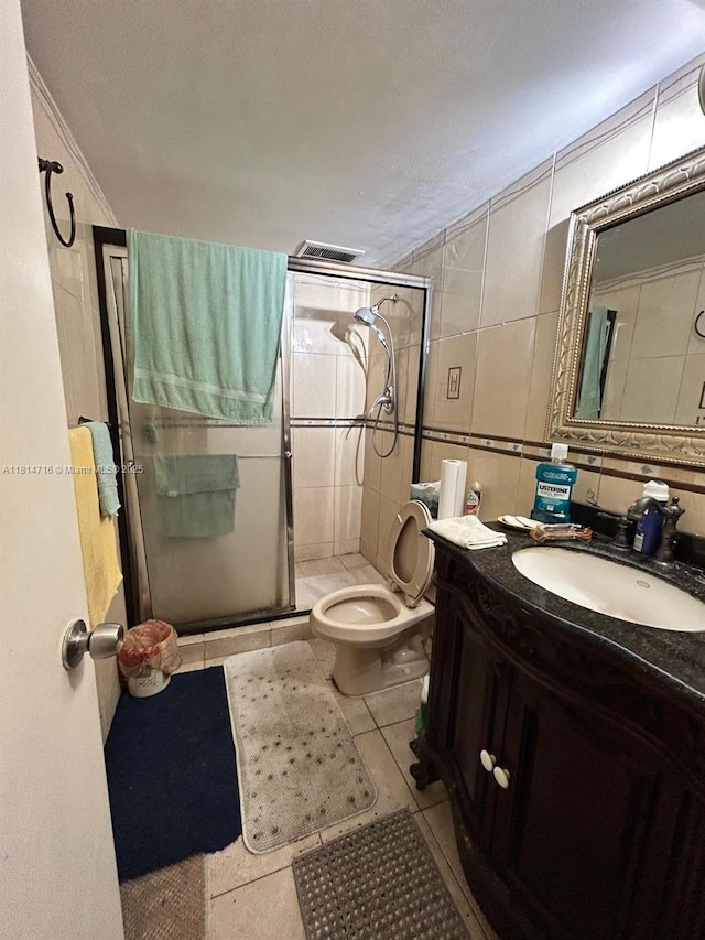 920 Ne 199th St 2S Apt 217, Miami, FL 33179 - full bath featuring a stall shower, vanity, tile patterned floors, ornamental molding, and tile walls