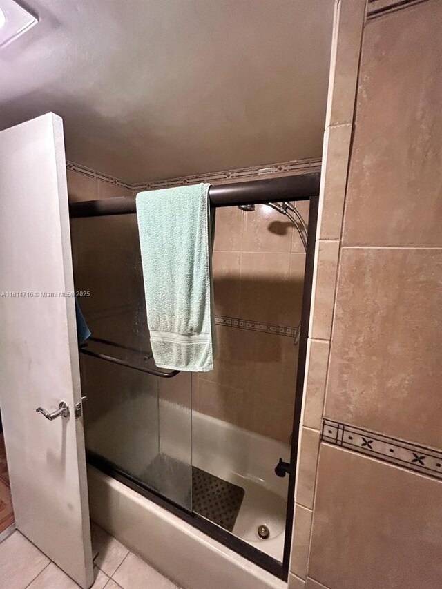 920 Ne 199th St 2S Apt 217, Miami, FL 33179 - full bathroom with a shower with shower door and tile patterned floors
