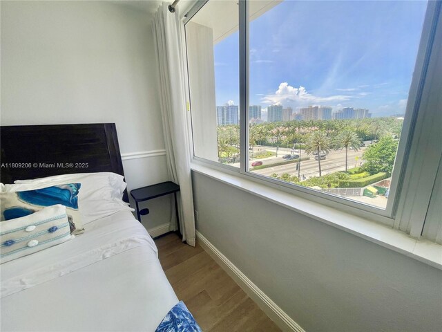 19201 Collins Ave Unit 427, Sunny Isles Beach, FL 33160 - bedroom with wood finished floors and a skyline view