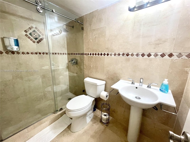 19201 Collins Ave Unit 427, Sunny Isles Beach, FL 33160 - bathroom featuring tile walls and a shower stall