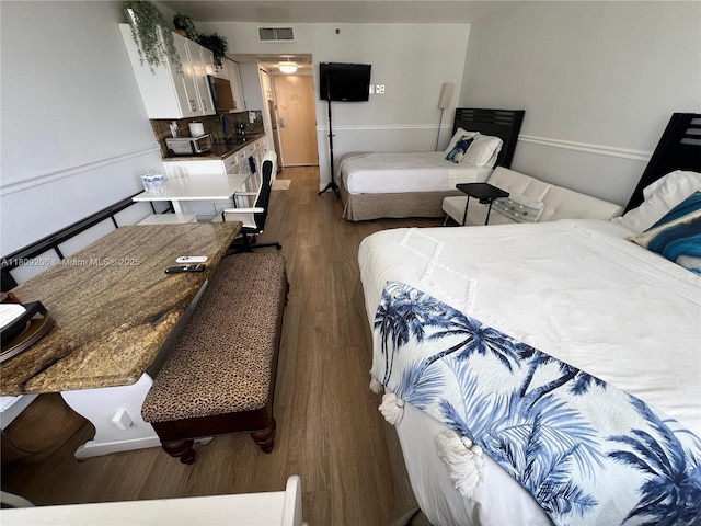 19201 Collins Ave Unit 427, Sunny Isles Beach, FL 33160 - bedroom featuring dark wood-type flooring