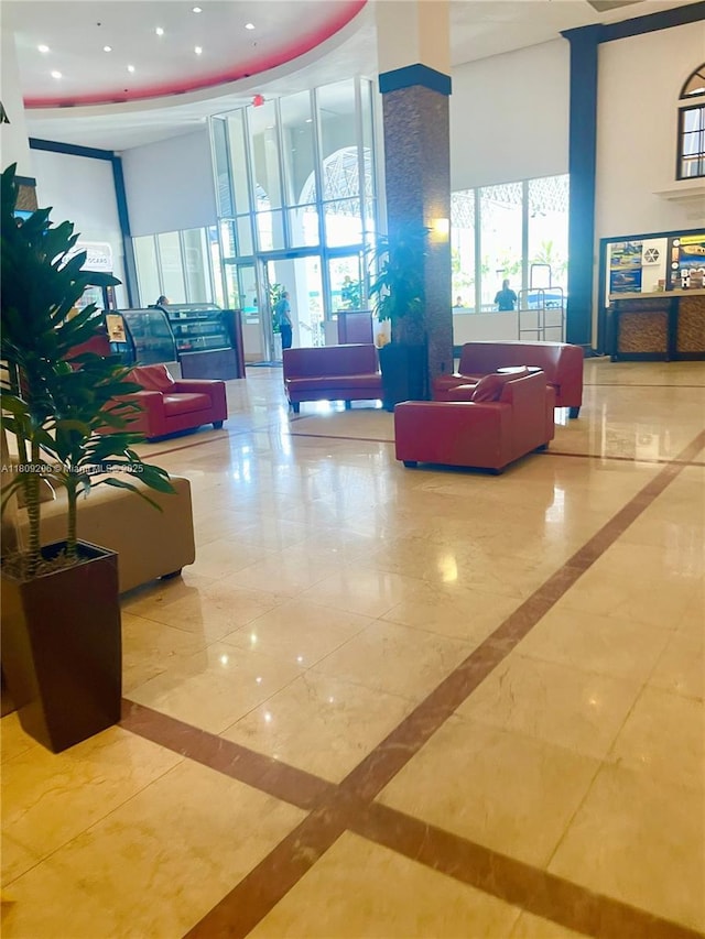 19201 Collins Ave Unit 427, Sunny Isles Beach, FL 33160 - lobby featuring a towering ceiling and recessed lighting