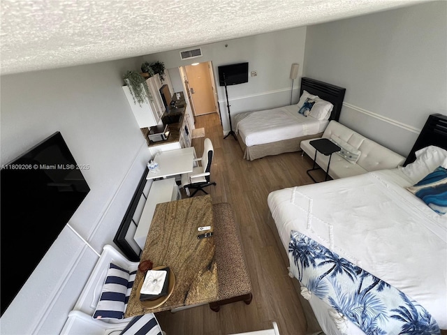 19201 Collins Ave Unit 427, Sunny Isles Beach, FL 33160 - bedroom with wood finished floors and a textured ceiling