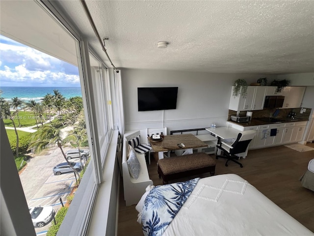 19201 Collins Ave Unit 427, Sunny Isles Beach, FL 33160 - living room featuring a textured ceiling and wood finished floors