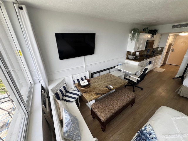19201 Collins Ave Unit 427, Sunny Isles Beach, FL 33160 - living area featuring dark wood finished floors and a textured ceiling