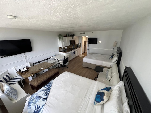 19201 Collins Ave Unit 427, Sunny Isles Beach, FL 33160 - living room featuring a textured ceiling and wood finished floors