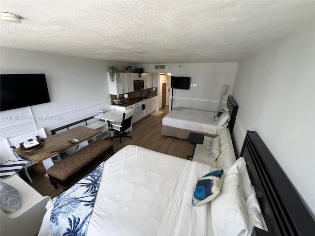 19201 Collins Ave Unit 427, Sunny Isles Beach, FL 33160 - living room featuring wood finished floors and a textured ceiling