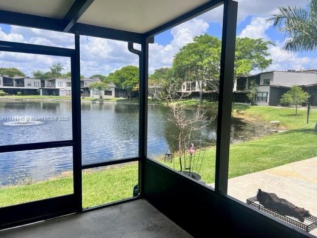 958 Mockingbird Ln Unit 511, Plantation, FL 33324 - unfurnished sunroom with a water view