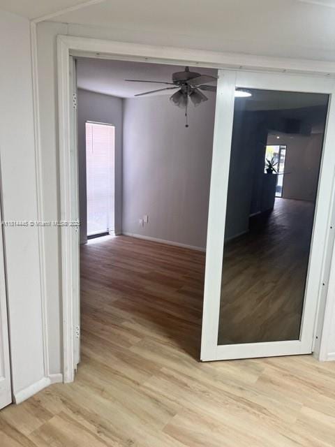 958 Mockingbird Ln Unit 511, Plantation, FL 33324 - hallway featuring light wood-style flooring and baseboards