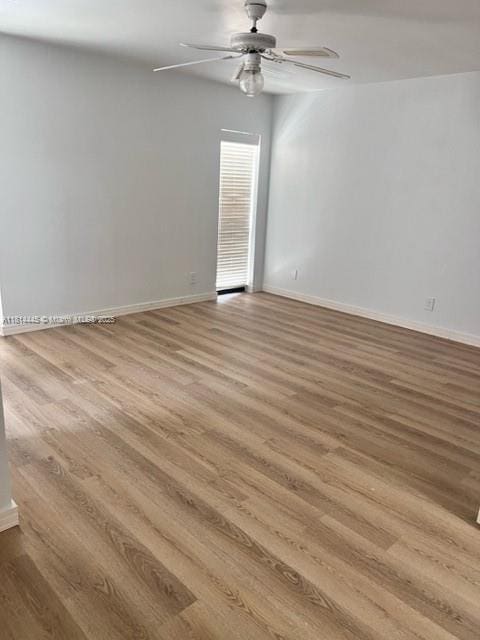 958 Mockingbird Ln Unit 511, Plantation, FL 33324 - empty room featuring ceiling fan, wood finished floors, and baseboards