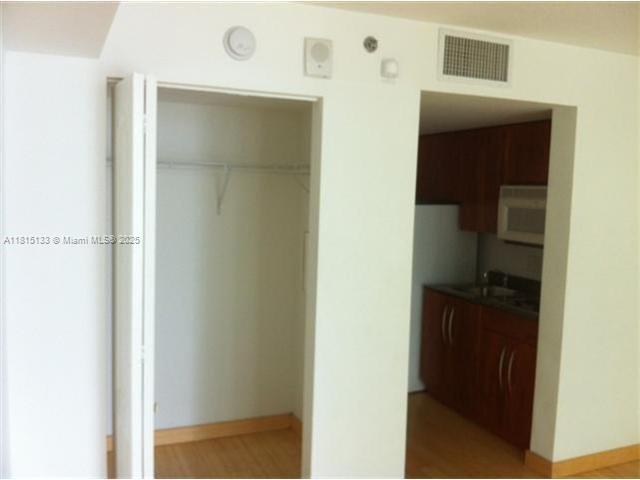 1200 Brickell Bay Dr Unit 3316, Miami, FL 33131 - closet featuring a sink
