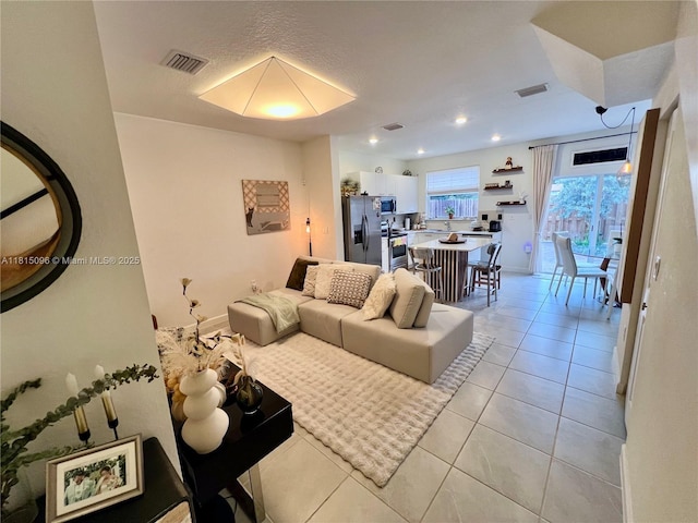12254 NW 24th Pl, Miami, FL 33167 - living room featuring light tile patterned flooring, recessed lighting, and baseboards