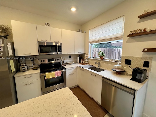 12254 NW 24th Pl, Miami, FL 33167 - kitchen with stainless steel appliances, a sink, decorative backsplash, open shelves, and white cabinets