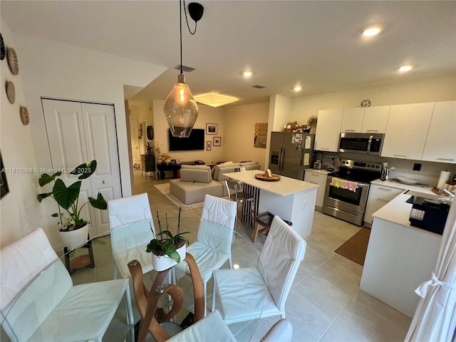 12254 NW 24th Pl, Miami, FL 33167 - dining area featuring light tile patterned flooring and recessed lighting