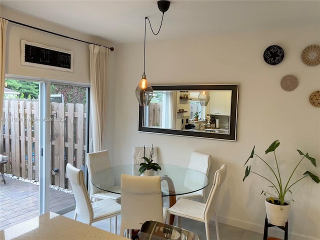 12254 NW 24th Pl, Miami, FL 33167 - dining area with baseboards and tile patterned floors