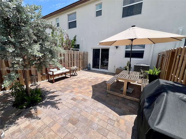 12254 NW 24th Pl, Miami, FL 33167 - rear view of property featuring a patio, stucco siding, and central air condition unit
