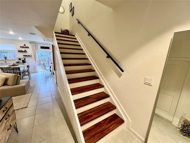 12254 NW 24th Pl, Miami, FL 33167 - staircase featuring tile patterned flooring and a textured wall
