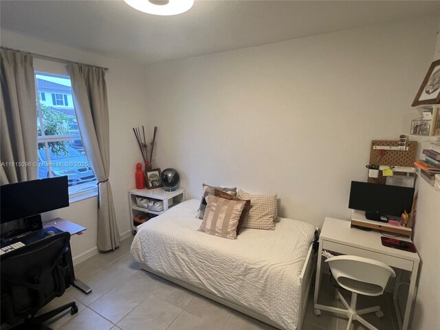 12254 NW 24th Pl, Miami, FL 33167 - bedroom featuring a desk and light tile patterned floors