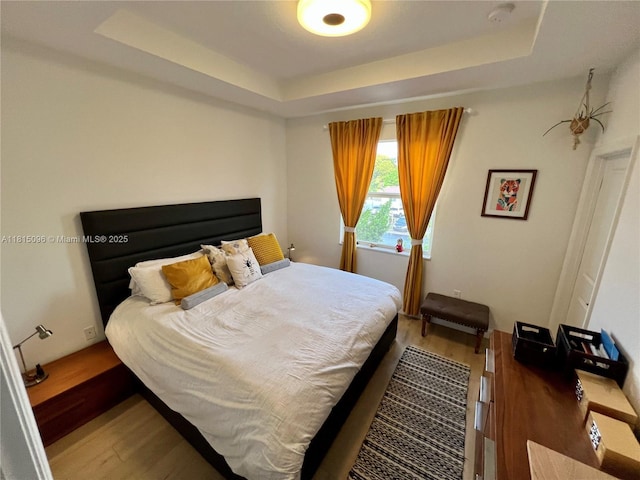 12254 NW 24th Pl, Miami, FL 33167 - bedroom with wood finished floors and a raised ceiling