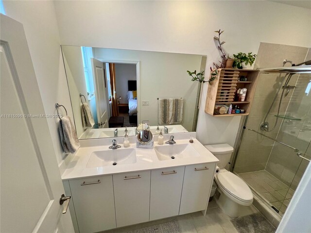 12254 NW 24th Pl, Miami, FL 33167 - ensuite bathroom featuring toilet, a shower stall, double vanity, and tile patterned flooring