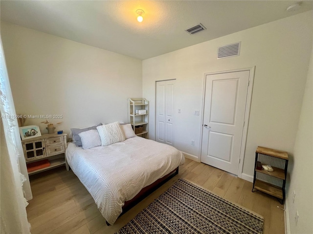 12254 NW 24th Pl, Miami, FL 33167 - bedroom with light wood-style flooring, baseboards, and a closet