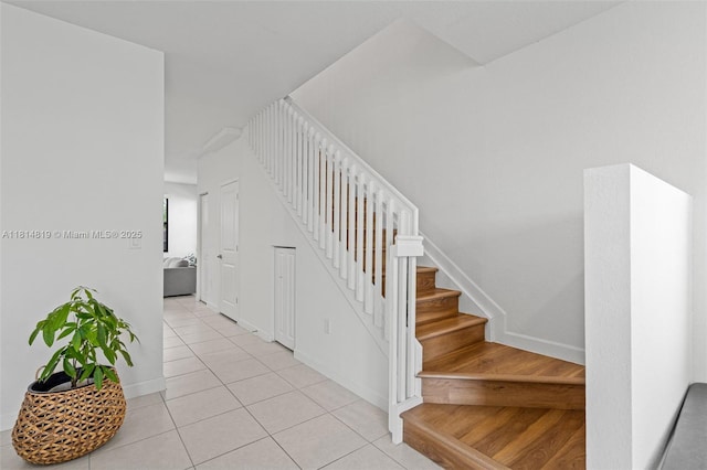 12945 SW 234th St, Homestead, FL 33032 - stairway with tile patterned floors and baseboards
