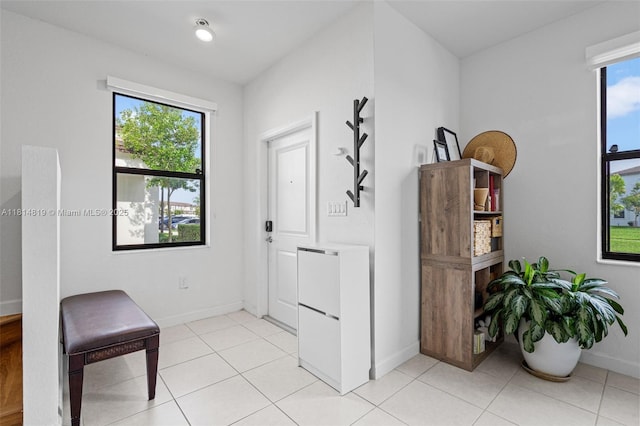 12945 SW 234th St, Homestead, FL 33032 - entryway with baseboards and light tile patterned floors