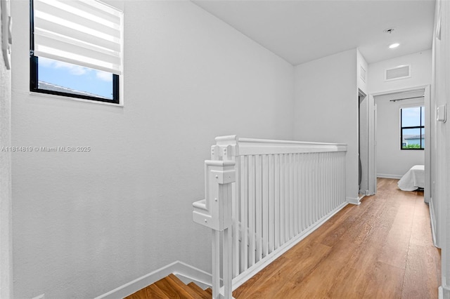 12945 SW 234th St, Homestead, FL 33032 - hall with an upstairs landing, wood finished floors, and baseboards