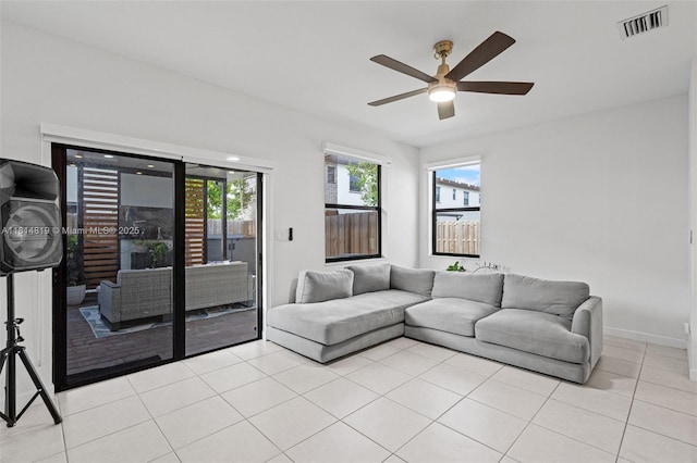 12945 SW 234th St, Homestead, FL 33032 - living room with a ceiling fan, light tile patterned floors, and baseboards