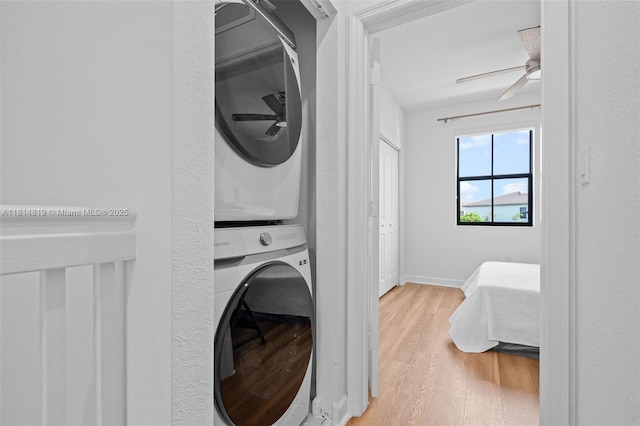 12945 SW 234th St, Homestead, FL 33032 - washroom featuring stacked washer / drying machine, wood finished floors, ceiling fan, and baseboards