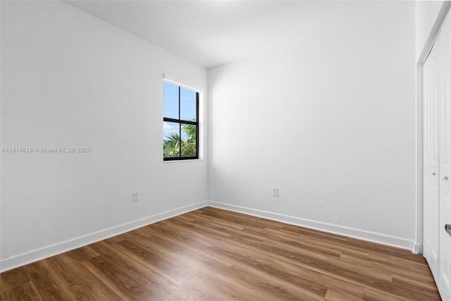 12945 SW 234th St, Homestead, FL 33032 - unfurnished bedroom with wood finished floors, baseboards, and a closet