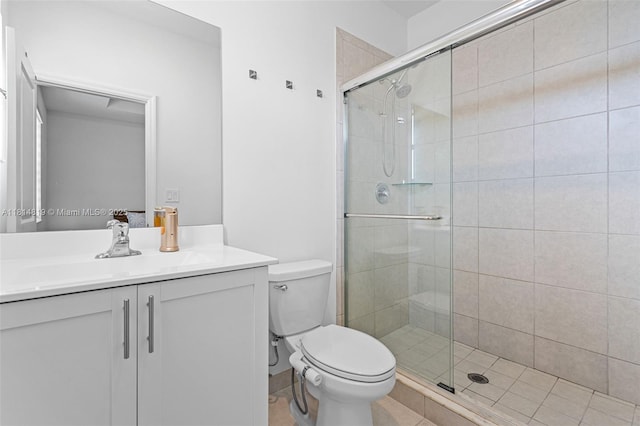 12945 SW 234th St, Homestead, FL 33032 - bathroom featuring vanity, a stall shower, toilet, and tile patterned flooring