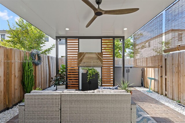 12945 SW 234th St, Homestead, FL 33032 - fenced backyard with outdoor lounge area, a ceiling fan, and a patio