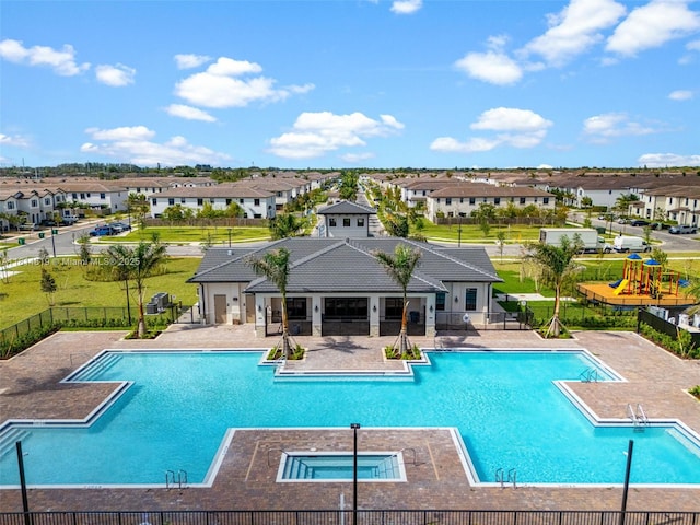 12945 SW 234th St, Homestead, FL 33032 - community pool with a patio, a residential view, a playground, and a community hot tub