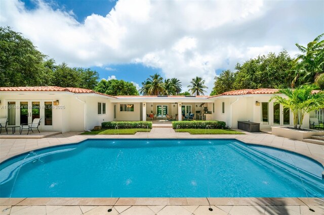 7505 SW 129th St, Pinecrest, FL 33156 - outdoor pool with french doors and a patio