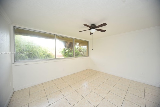 1750 W 56th St Unit 108, Hialeah, FL 33012 - empty room with ceiling fan, ornamental molding, light tile patterned flooring, and baseboards