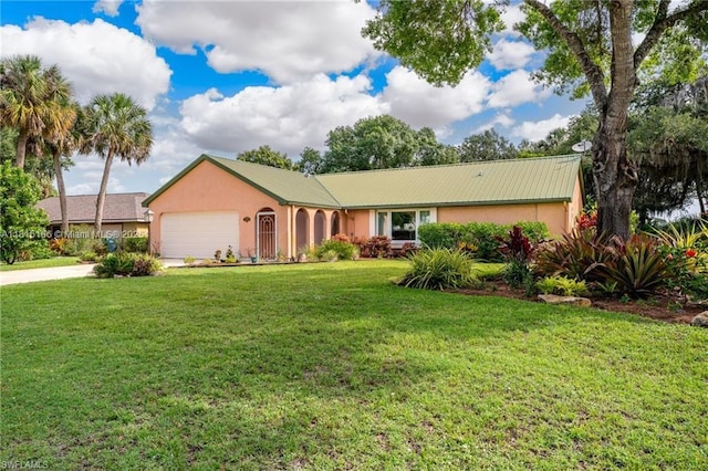 4559 Springview Cir, La Belle, FL 33935 - single story home featuring stucco siding, an attached garage, a front yard, metal roof, and driveway