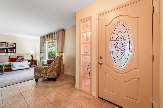 4559 Springview Cir, La Belle, FL 33935 - foyer entrance with light tile patterned floors, light carpet, and baseboards