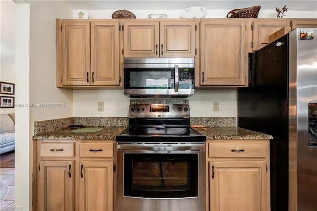 4559 Springview Cir, La Belle, FL 33935 - kitchen with appliances with stainless steel finishes, light brown cabinets, and dark stone countertops